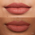 Close-up of lips wearing a bold soft matte lipstick shade with a smooth finish.

