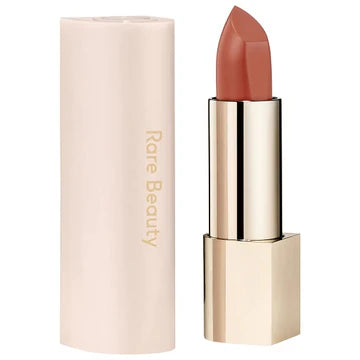 Product shot of lipstick with cap off, showing the creamy bullet texture.

