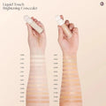 Close-up of concealer swatched across multiple skin tones to show shade diversity.

