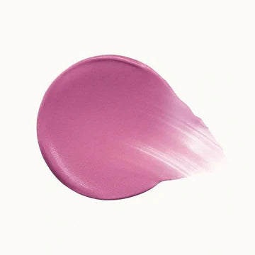 Close-up of liquid blush applicator with a soft pink product drop

