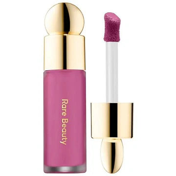 Blush being blended on the cheek with fingers for a natural finish

