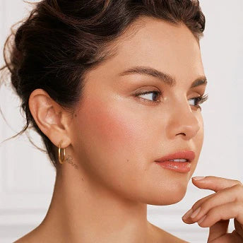 Close-up of liquid blush applied to cheek with a natural dewy finish.


