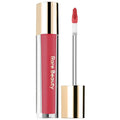 Model applying lip gloss, showcasing a smooth and shiny finish.

