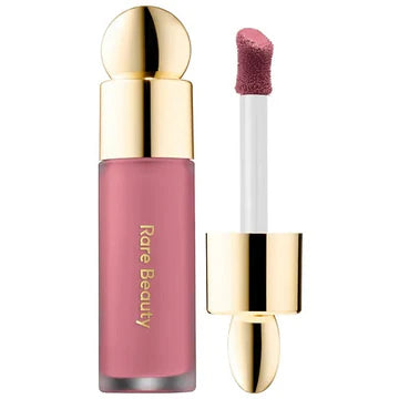 Product packaging showing applicator and fluid texture