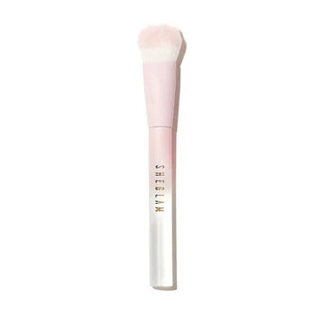 Sheglam Color Bloom Liquid Blush Brush packaging, showcasing the unique angled brush with a cat paw print design. The compact case or sleeve is sleek and modern, designed for easy storage or travel, with branding highlighting its precision for liquid blush application