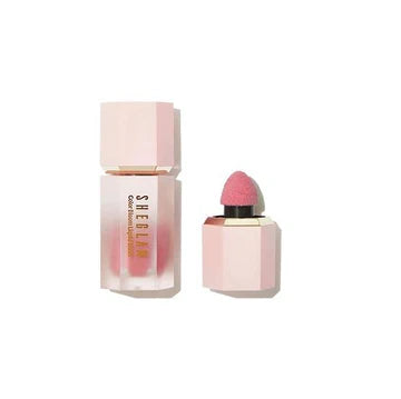 SHEGLAM Color Bloom Dayglow Liquid Blush in the shade 'Love Cake,' featuring a sleek tube packaging with a doe-foot applicator. The label includes contact information (TEL: 1234567890) for customer support