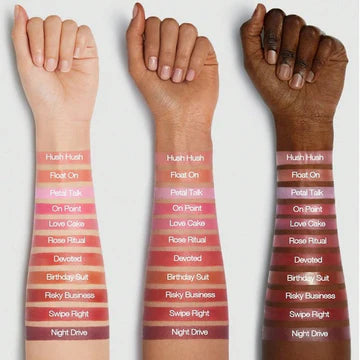 Front and side view of SHEGLAM Color Bloom Dayglow Liquid Blush bottle in On Point shade, featuring a sleek transparent tube with metallic gold accents that shows the blush's shimmering liquid formula inside. The minimalist design displays the brand logo and product name in bold typography