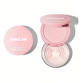 A close-up of the Sheglam Insta-Ready Face & Under Eye Setting Powder Duo palette, highlighting the available shades. The palette includes: Bubblegum (a light pink shade for brightening), Translucent (for all skintones), Bisque (for light to medium tones), Natural Linen (for medium tones), Toasted Almond (for medium to tan tones), Smooth Sand (for tan tones), and Cocoa Loco (for deep tones).