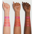 different skin tones (light, medium, and dark) are shown with swatches of four Sheglam Jelly-Licious Hydrating Lip & Blush Tint shades applied to their inner forearms. From top to bottom on each arm, the shades are 
