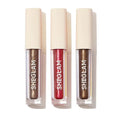 SHEGLAM Starry Wish Liquid Eyeshadow Trio in ‘Spaced Out,’ with repeated brand mark ‘SHECIAM’ on packaging. The sleek tube design suggests a metallic or glittery formula, ideal for celestial-inspired eye looks