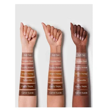 Front and side view of SHEGLAM Sun Sculpt Liquid Contour packaging, showing a sleek, tube-style bottle with a matte finish and gold accent details. The product label clearly displays 'Sun Sculpt Liquid Contour' in bold typography, along with shade name and brand logo. The twist-up design and precision applicator tip are visible