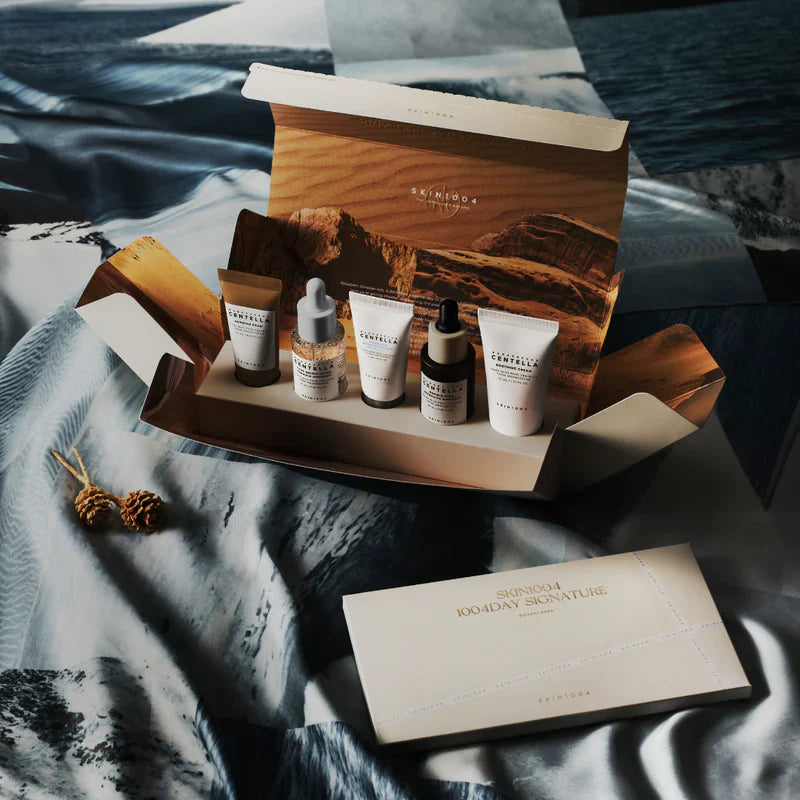 Skincare product set with wooden box on a textured surface