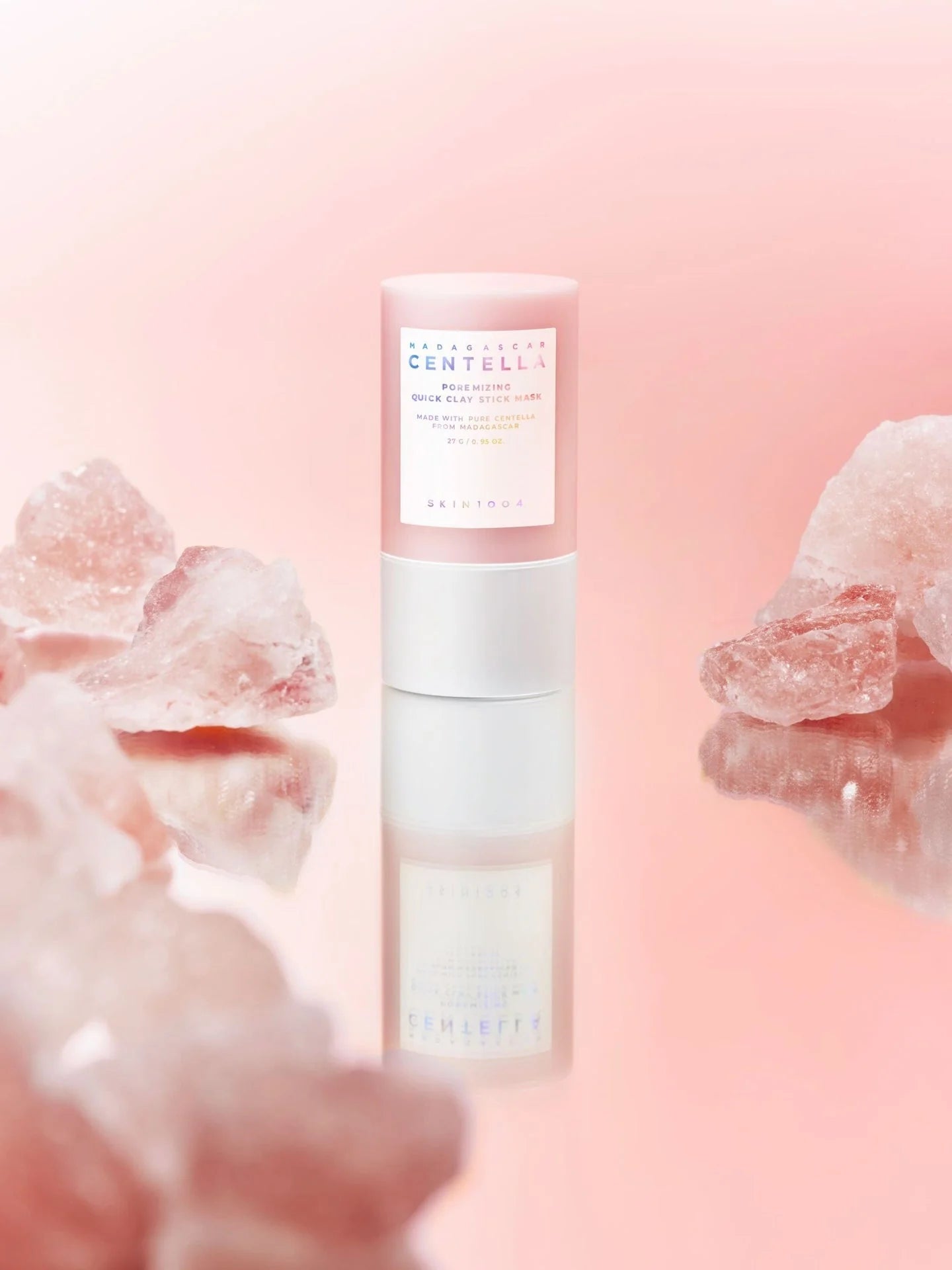 Skincare bottle with a pink background and floral elements