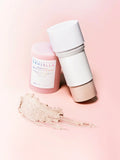 Two skincare products on a pink background