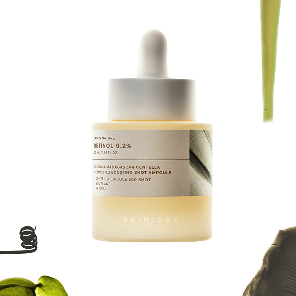 Skincare ampoule with dropper labeled 'SKIN1004' on a white background