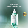 SKIN1004 Tea-Trica Relief Ampoule bottle on a green gradient background