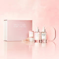 Cosmetic set with bottles and a box on a pink background
