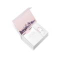 Gift set with a pink box and purple floral design on a white background