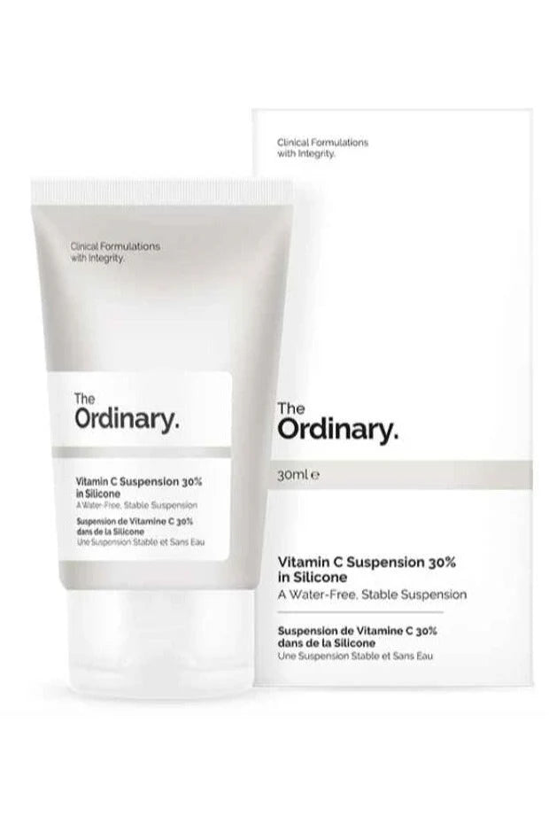 Silky, smooth cream texture of Vitamin C Suspension applied to skin, showing lightweight finish and glow.