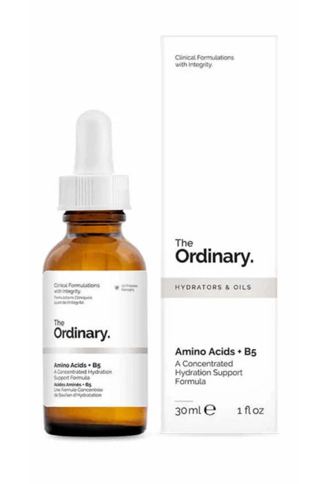 Dropper releasing clear serum onto the skin, showing texture and absorption

