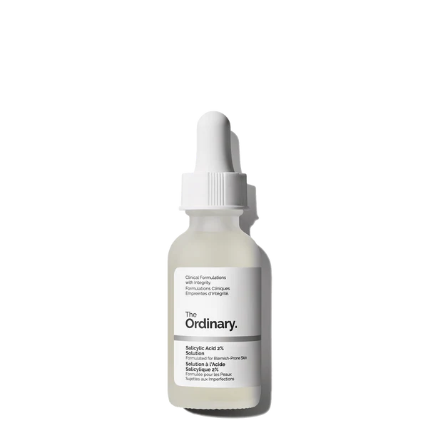 Dropper dispensing The Ordinary Salicylic Acid 2% Solution onto the back of a hand to show texture.

